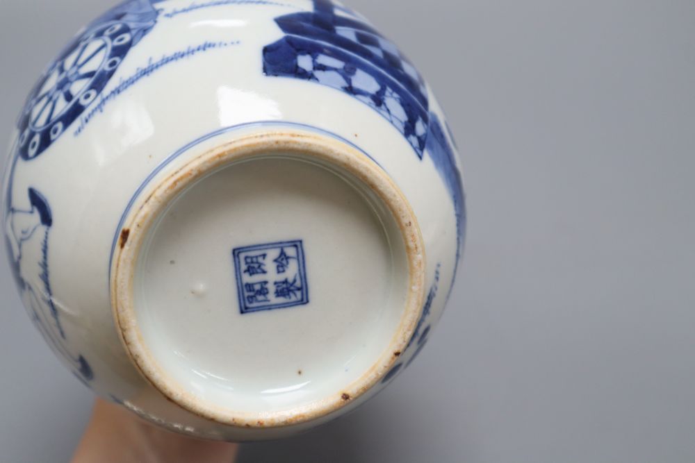 A Chinese blue and white figurative bottle vase, with four character mark to base, height 26cm